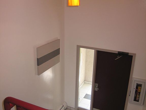 The building is secure with a well-lit outer vestibule and intercom system. The inner door is accessed only by key or intercom release.