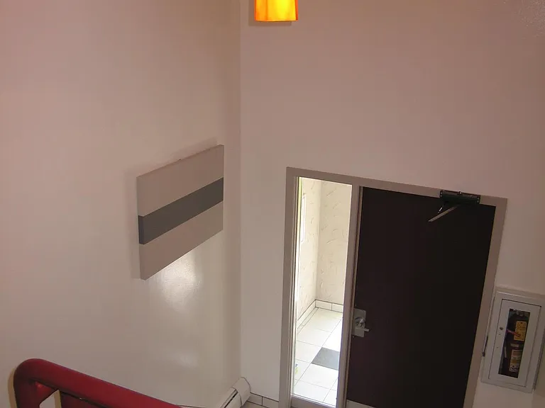 The building is secure with a well-lit outer vestibule and intercom system. The inner door is accessed only by key or intercom release.