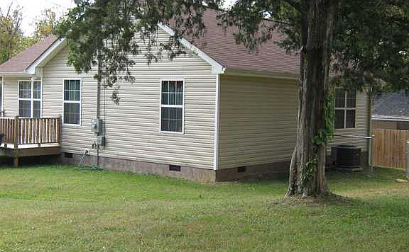 NICE SIZE YARD WITH PRETTY TREES