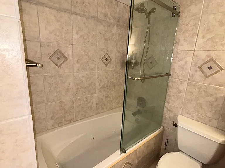 Primary bathroom of whirlpool bathtub