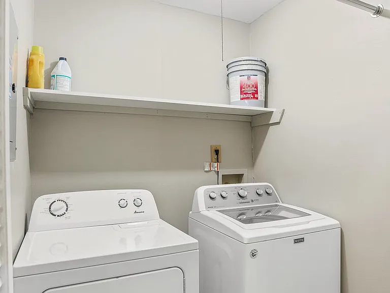 Laundry room with washer and dryer; owner pays the H.O.A. fee