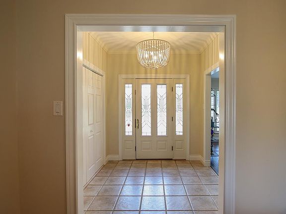 Beautiful Leaded Glass Door entry way. Tile floor for easy clean/maintenance.
