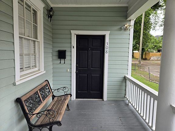 Porch and entry way. Private parking on grass lane to right.