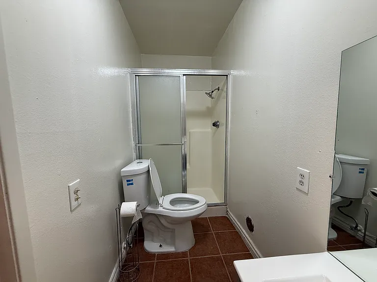 Common area bathroom. Totally remodeled. New counter, sink, faucet, cabinets, mirror, toilet, tile, shower, paint.