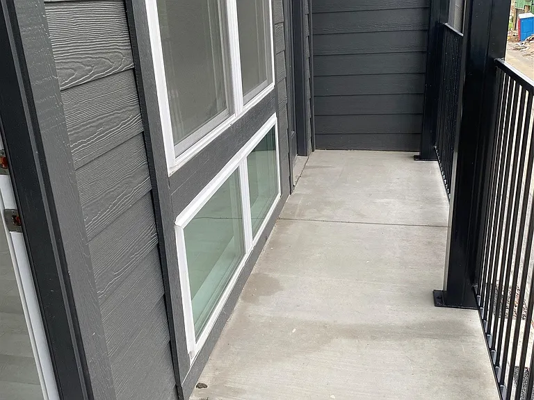 Covered balcony over the garage is great when entertaining.