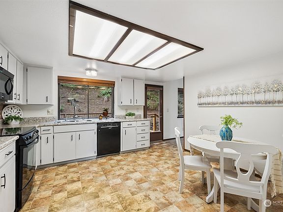 The huge, open kitchen will delight the cook. The breakfast nook is ideal for casual dining or visiting with the cook. >