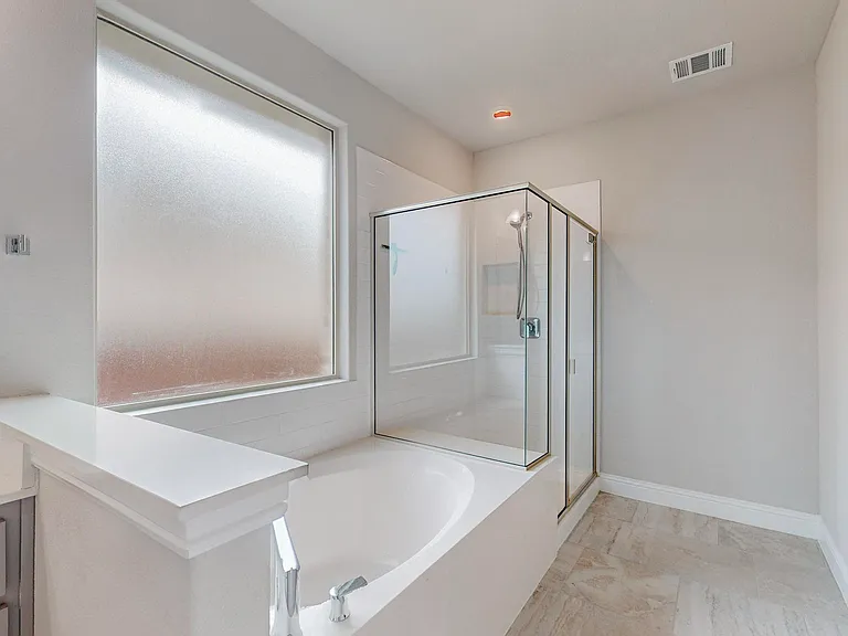 Primary bath with separate steam shower and tub