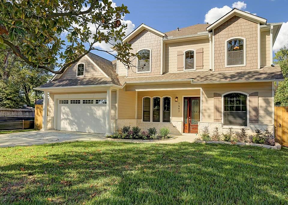 Charming Custom Family Home with Downstairs Master and Great Open Living Spaces