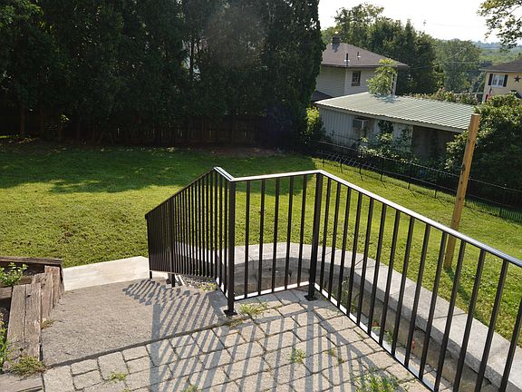Patio leading to fenced in back yard
