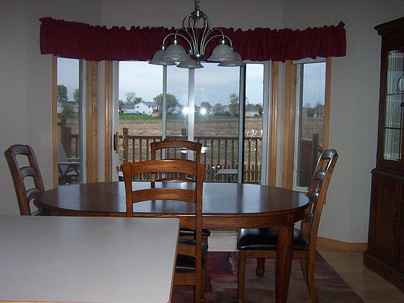 View from kitchen to informal dining area and deck