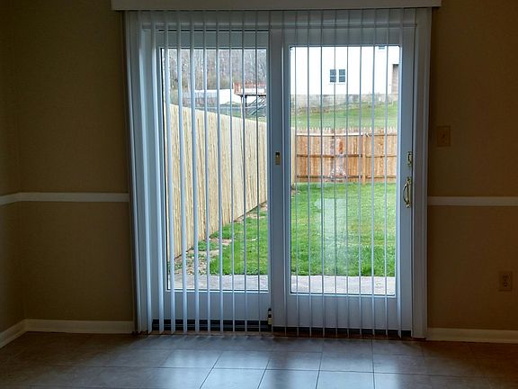 Eat-in Kitchen looking out to fenced yard.