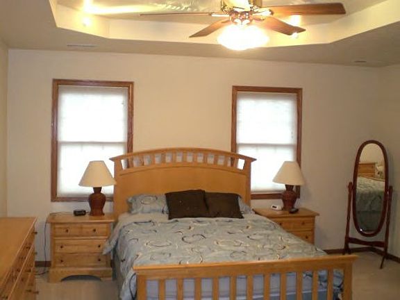 master bedroom with tray ceiling.