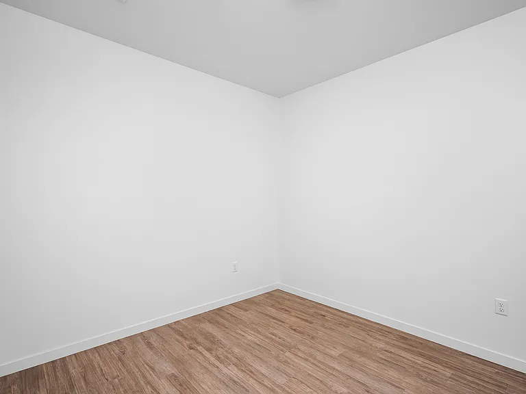 Bright and airy room with fresh white walls and elegant wooden flooring, perfect for a modern living space. Bright and airy room with fresh white walls and elegant wooden flooring, perfect for a modern living space.