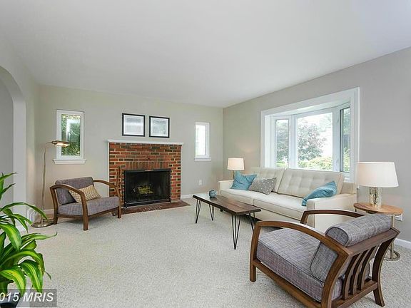 Living Room w/ wood burning fireplace