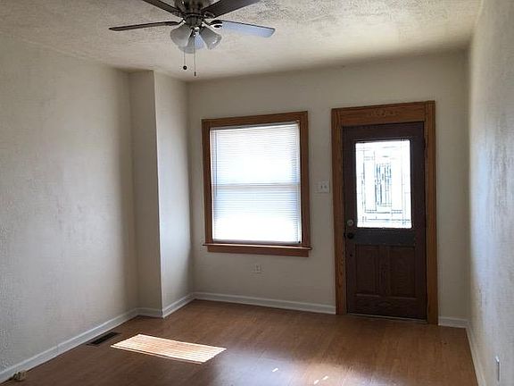 Living room with glass entry door.