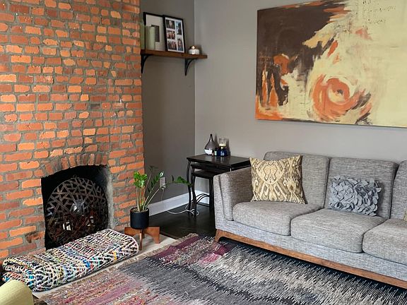 Living room - right as you walk in the front door. TV can be mounted on the right wall as you walk in, not on fireplace.