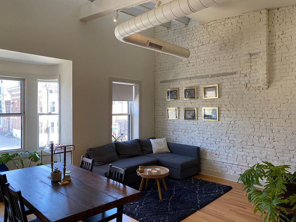 Exposed brick and lofted ceilings in the living room