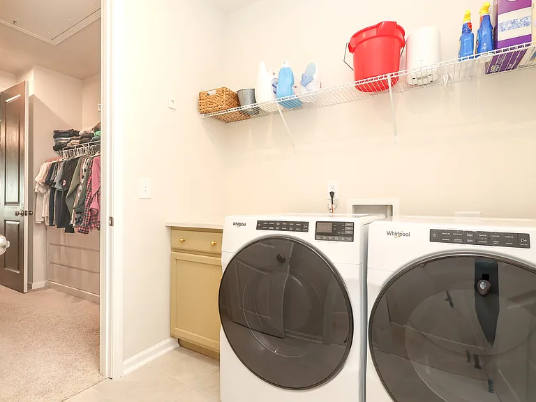 Upstairs laundry room with high-efficiency appliances