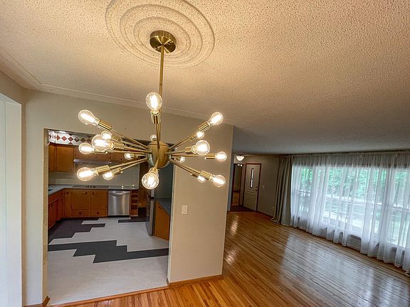 Living and dining room flowing to kitchen.