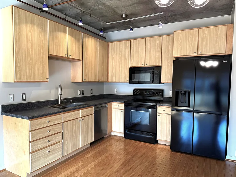 Kitchen with new fridge and dishwasher