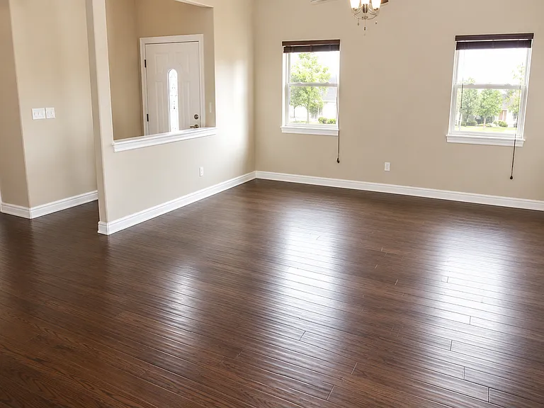 Spacious main living area with hardwood floors and plenty of natural light.