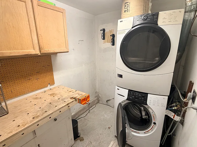 Private Laundry and Storage Room in space under the back stairs