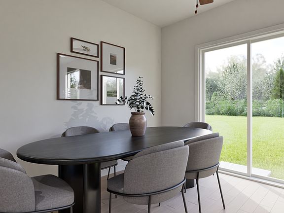 The dining room is spacious and leads to the back yard.