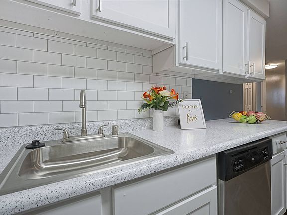 Novela Apartments Kitchen sink and subway tile