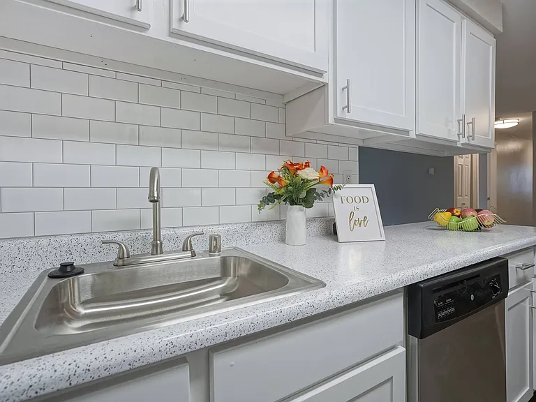 Novela Apartments Kitchen sink and subway tile