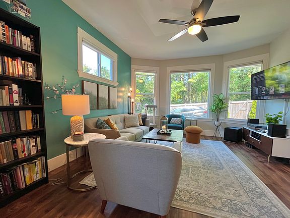 Living space with beautiful wraparound windows and great proportions!