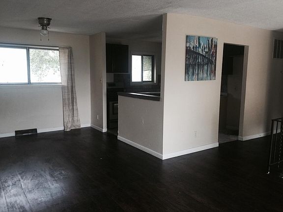 open concept living and dinning room open to the kithcen