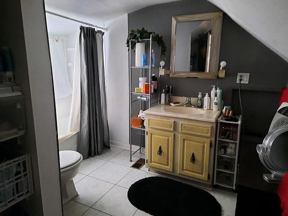 Bath with tub and shower.