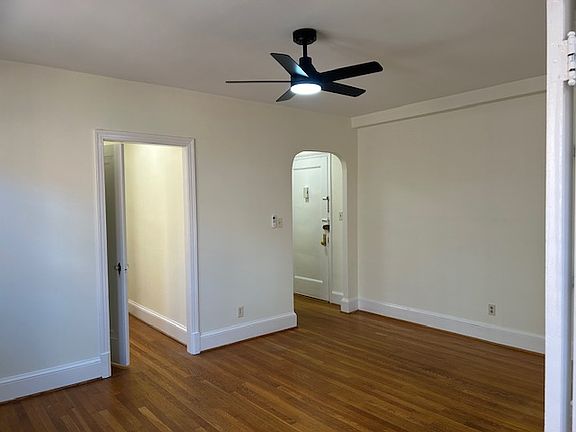 Charming Living Area with Wood Floors throughout