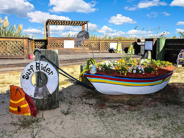Moe fish and a boat tender used for landscaping on Surfrider beach