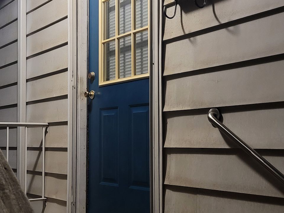 Front door, left side of house if facing from 6th Street.