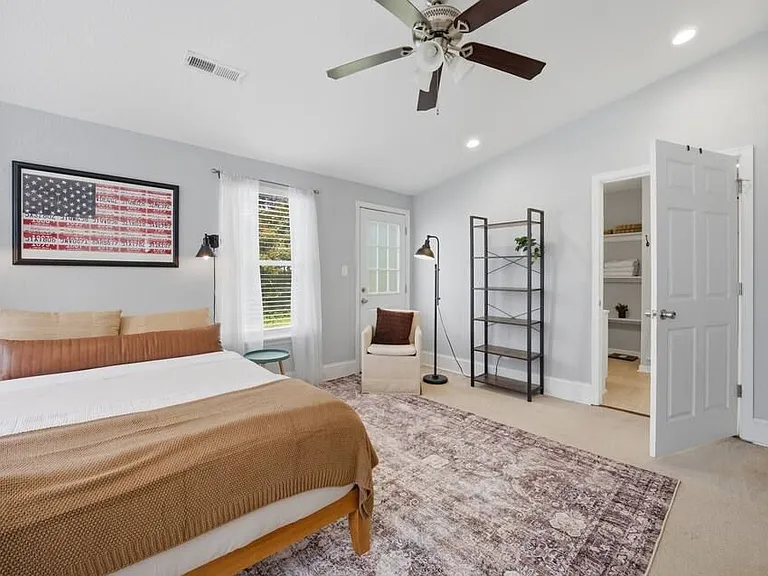 Room 1: Primary bedroom with Queen size bed. Very spacious with walk-in closet and en suite bathroom.
