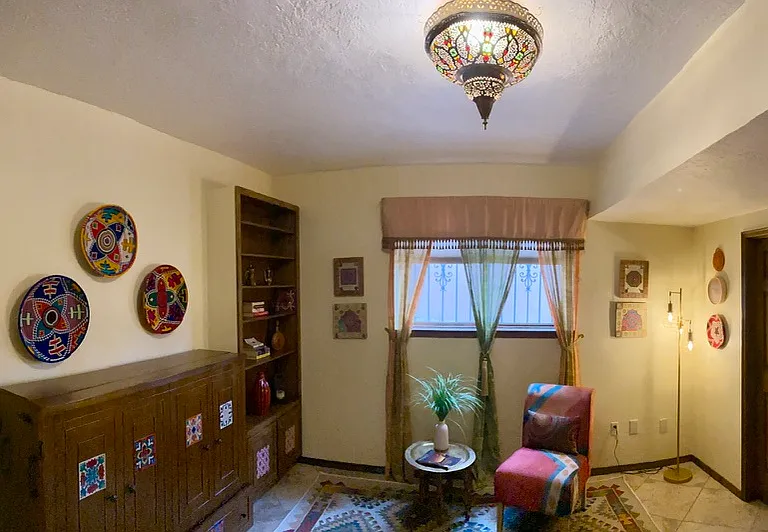 This is the Moroccan Room. The cabinet opens into a bed. You must go through this room to get to the laundry room. The second door in the room is a large walk-in closet.