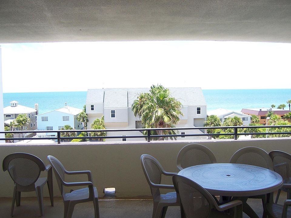Covered seating area just outside condo