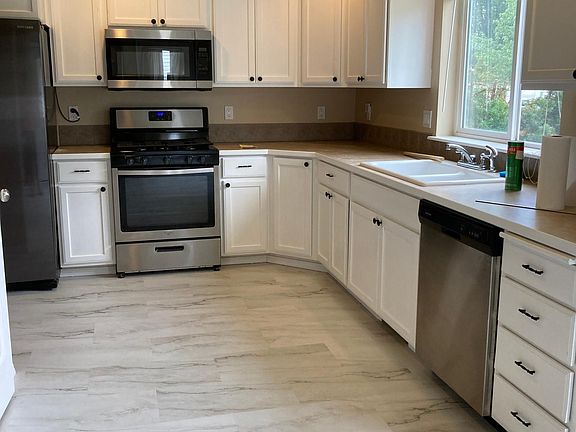 Beautiful brand new luxury vinyl plank flooring. Newer stainless appliances and newly painted cabinets