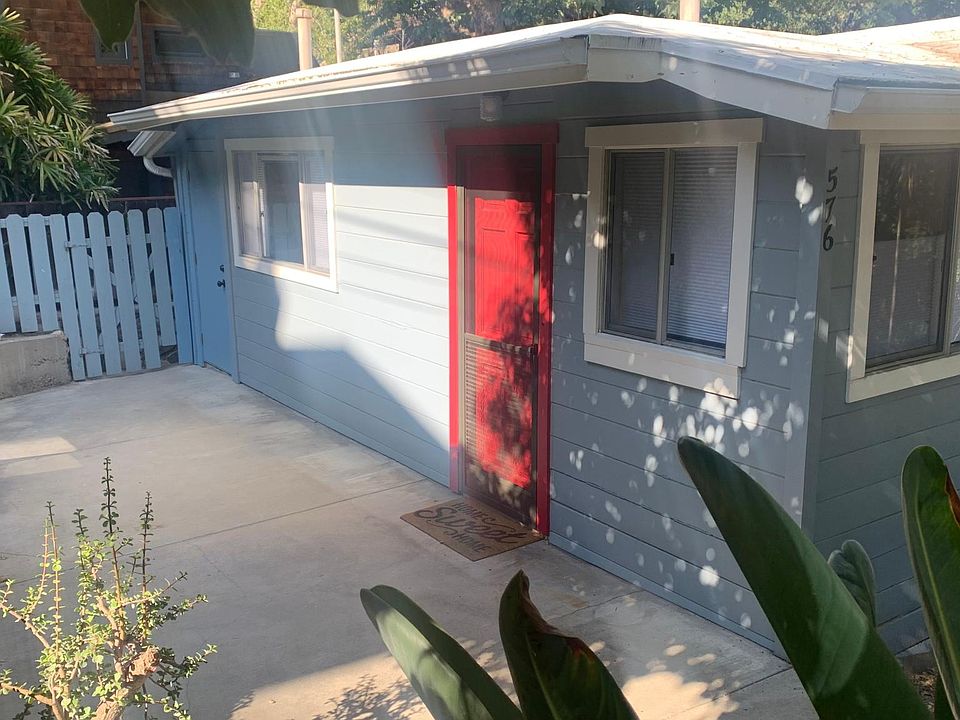 Front view of home with private patio area.