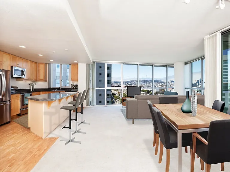 Classic Phase I kitchen, living and dining areas with stainless steel appliances and granite countertops