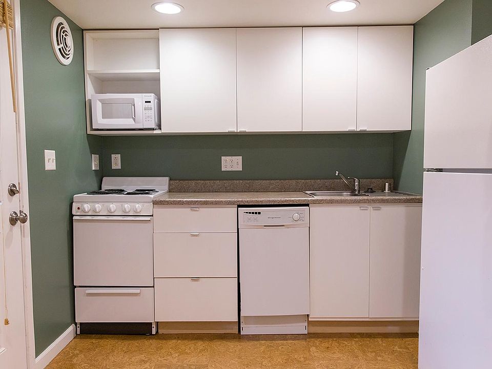 Kitchen with dishwasher, garbage disposal and full size fridge.