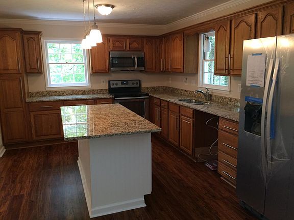 Brand new kitchen with new appliances and granite