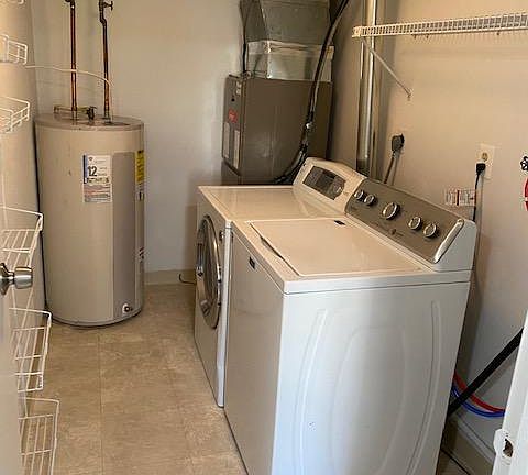 In house laundry room just off kitchen. Separate room, washer and dryer supplied. New central air and heating system just instal