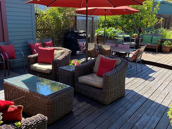 Out door dining, living space over looking fire pit, organic vegetable and fruit trees.