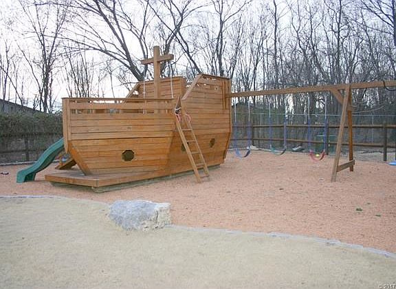 Another view of the playset and swings.