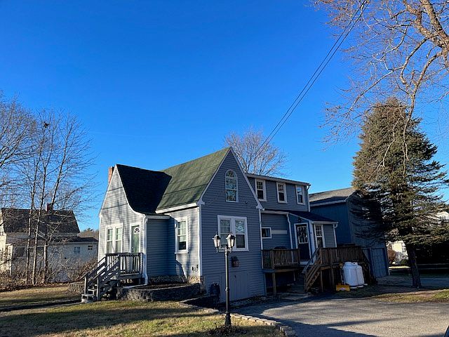 2 parking spaces, entryway, and grilling deck