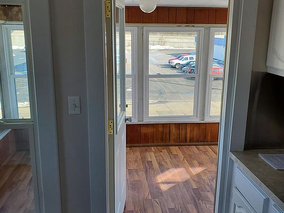 Kitchen looking out to 3 season porch in front.