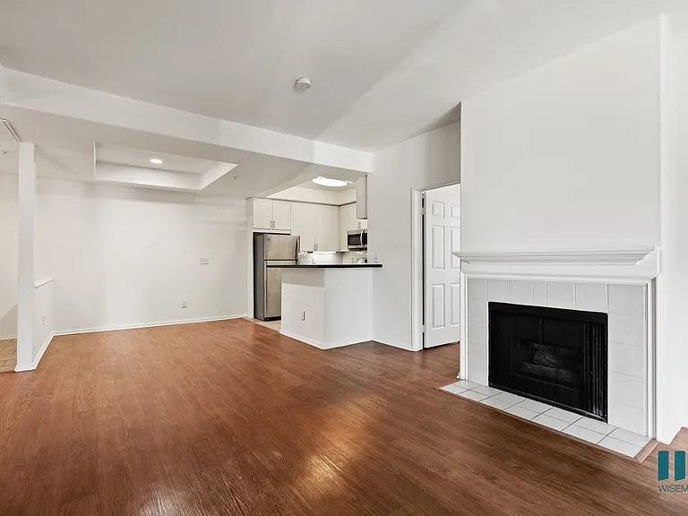 Open-Concept Kitchen, Dining, and Living Room with an Electric Fireplace
