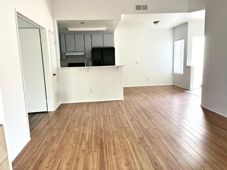 View of kitchen and dining space from living room